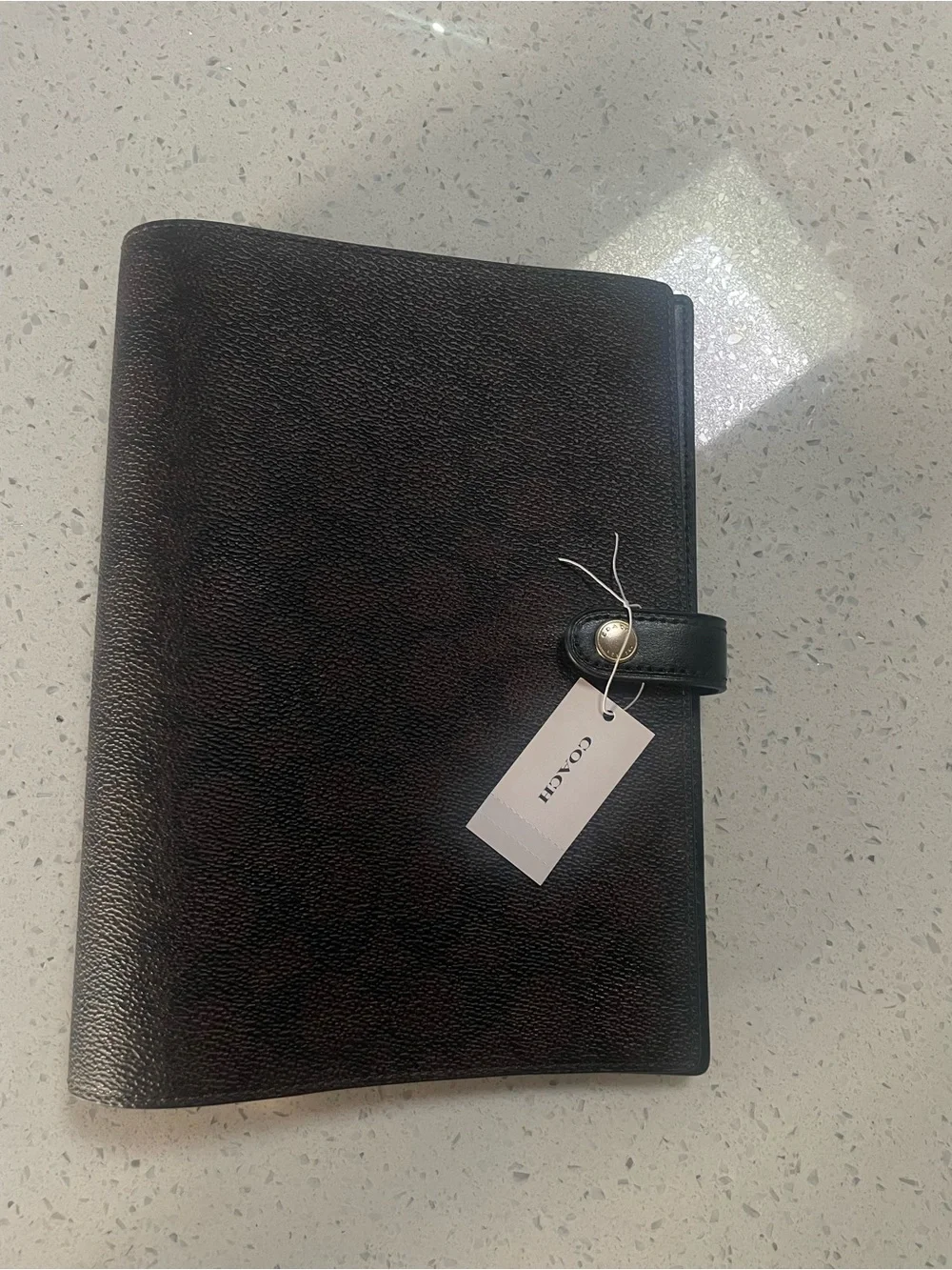 Coach Dark Brown Pebbled Leather Planner with Black Snap Strap